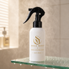 Sole MIST™ Exfoliating Foot Spray bottle on bathroom counter