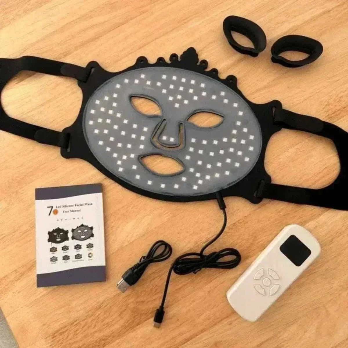 Pro Light Thera™ Mask, black silicone LED face mask with perforated light panel, adjustable straps and handheld controller.
