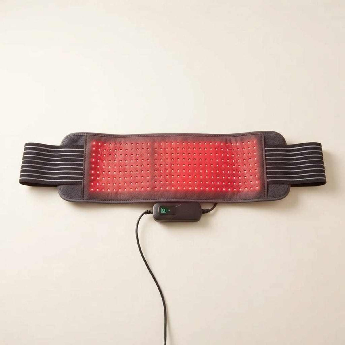 Red Light Thera™ Belt with a black flexible fabric strap, striped elastic bands, and a central panel of red LEDs.