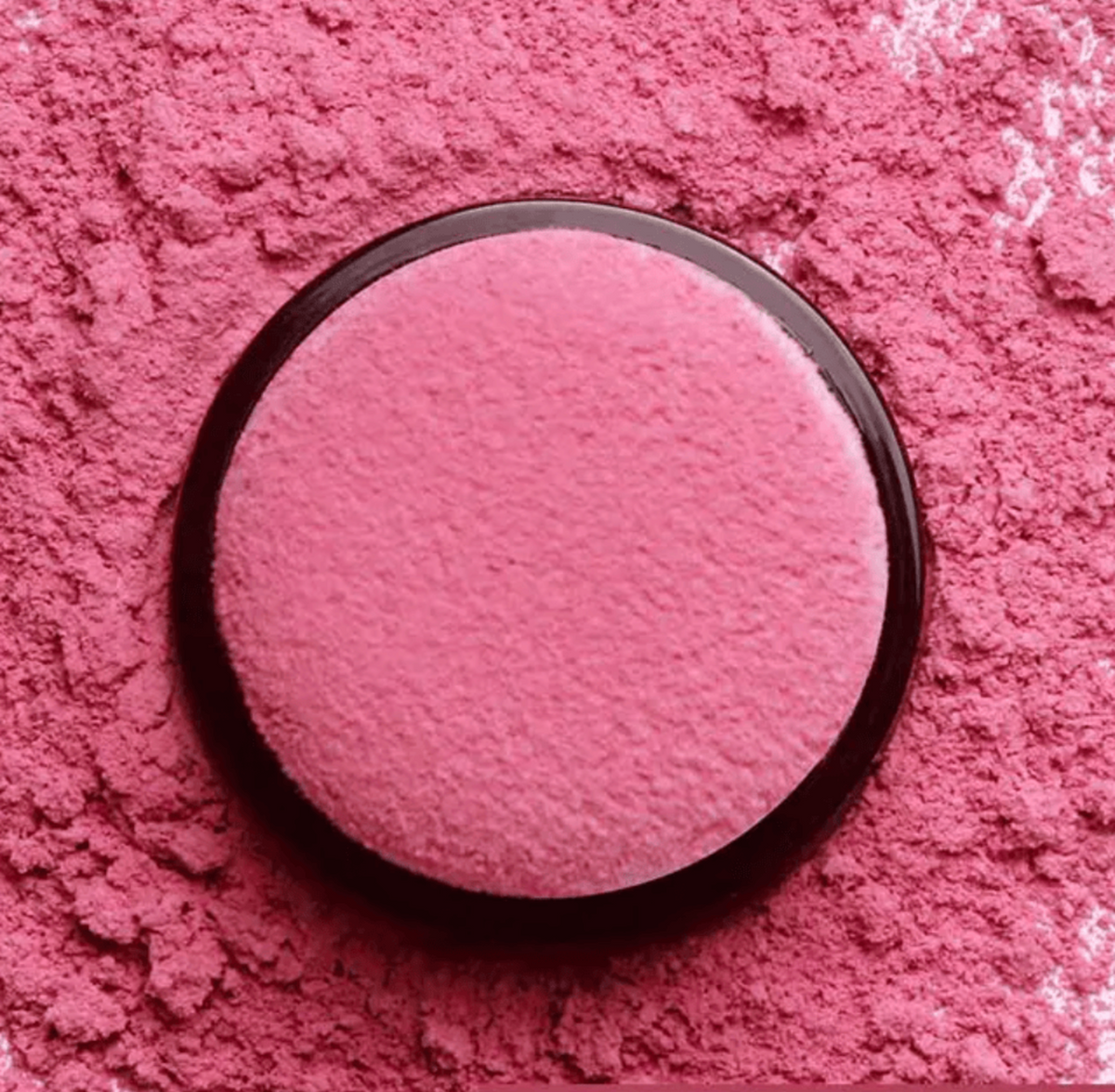 Veloura™ Powder Blush Set, a single pressed powder pan in rosy pink with a finely textured finish and dark compact rim